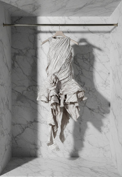 Textured dress with ruffled layers on a white background